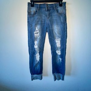 Size 7 Blue wash, ankle length fitted, distressed skinny jeans.